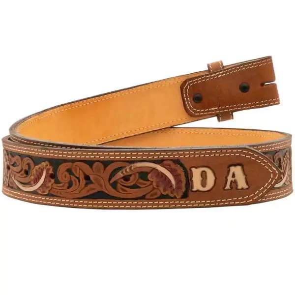 "Our Tooled Initial Western Belt offers the perfect touch of rustic charm. This belt features an intricate tooling pattern with hand-painted accents and a customizable tip for initials or lettering. Crafted from natural, top-grain leather and stitche